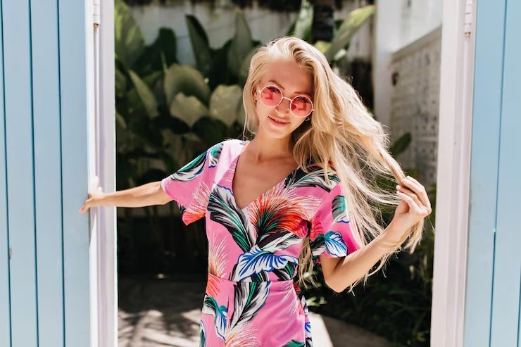 gorgeous-european-female-model-playing-with-her-long-blonde-hair-outdoor-photoshoot-photo-graceful-tanned-girl-bright-summer-dress