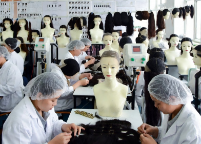 Skilled workers hand-knotting premium human hair wigs in a Qingdao wig factory